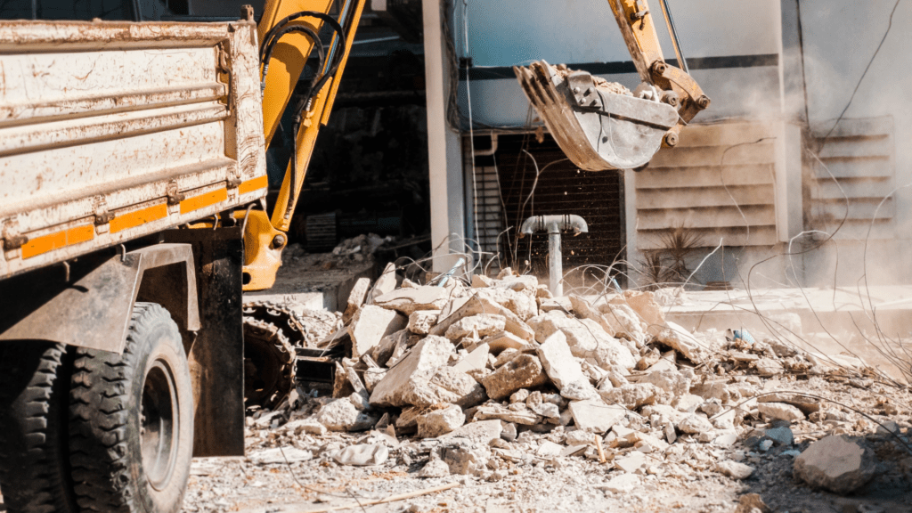 Excavator Picking up Construction Site Debris