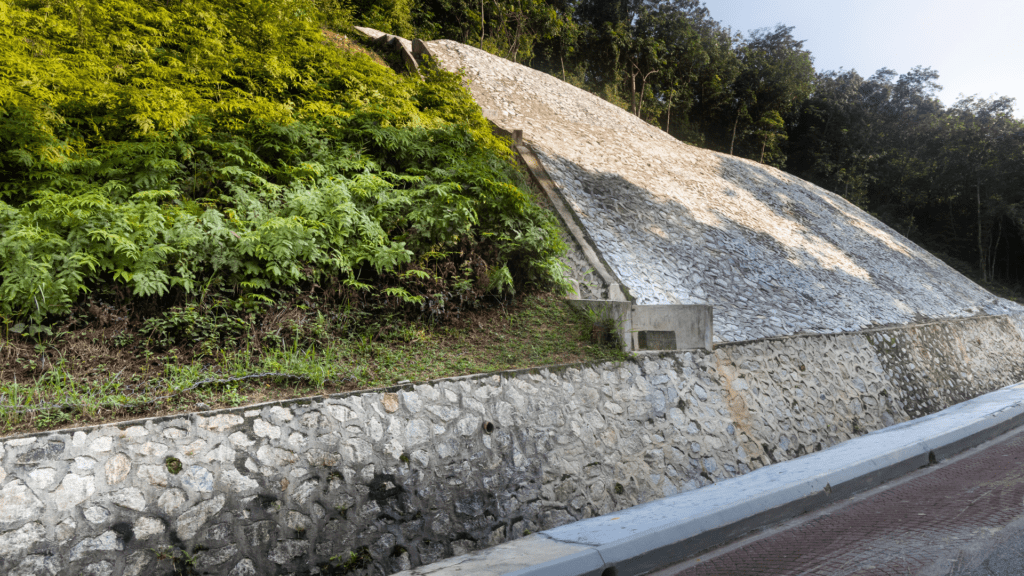 Rock concreted into the side of a hill to prevent the land from eroding/falling
