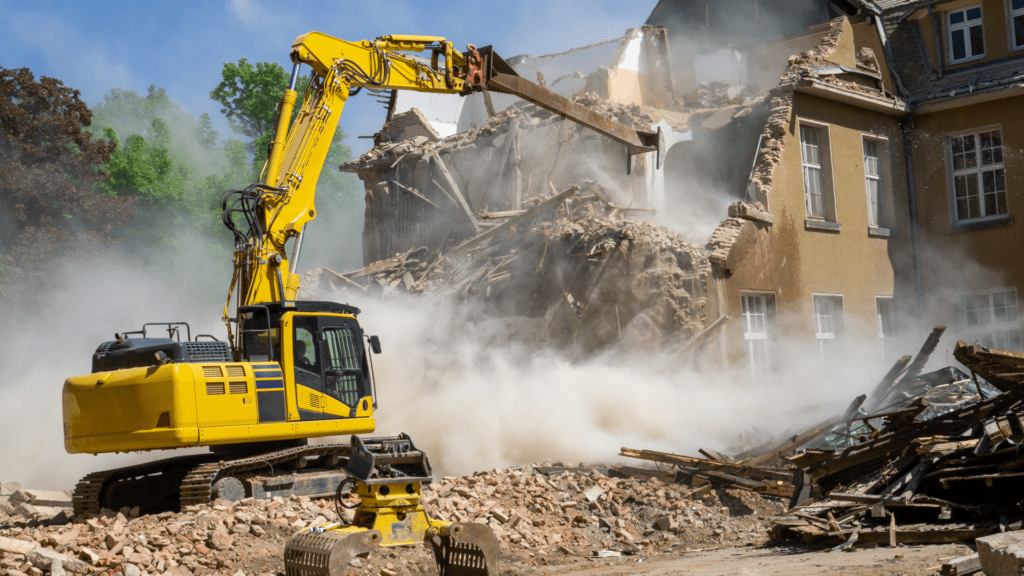 Excavator Knocking Down a building