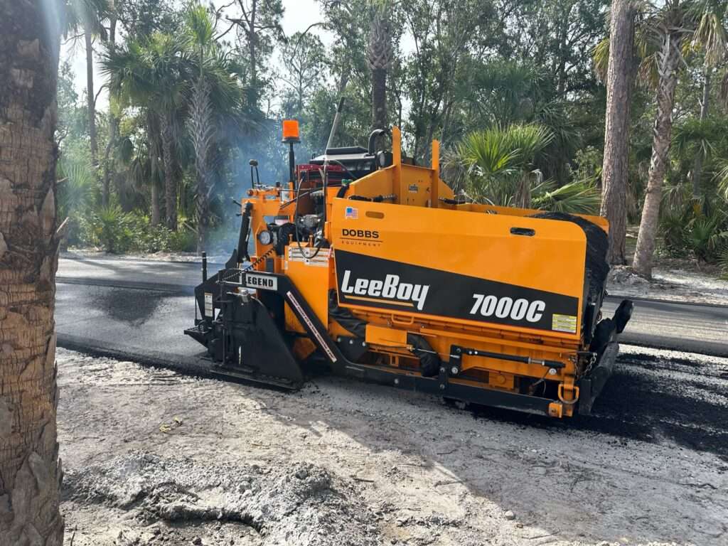 a paver, road paver finisher, asphalt finisher, or road paving machine